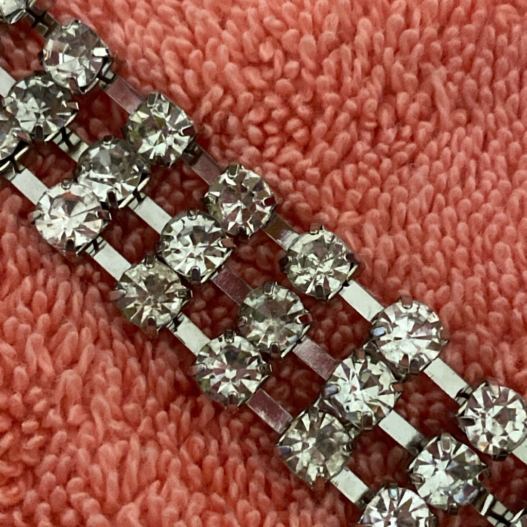 Lustrous Silver Multi-Strand Necklace With Oversized Rhinestones